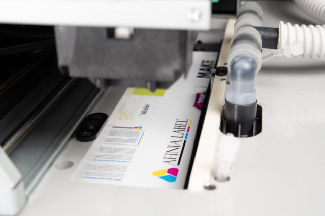 Afinia Label X350 Inkjet label press under printhead print zone