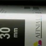 Label closeup as it exits the X350 label printer for visual inspection
